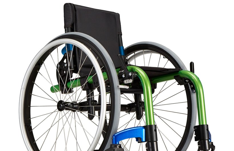 A green and black Little Wave Clik manual wheelchair