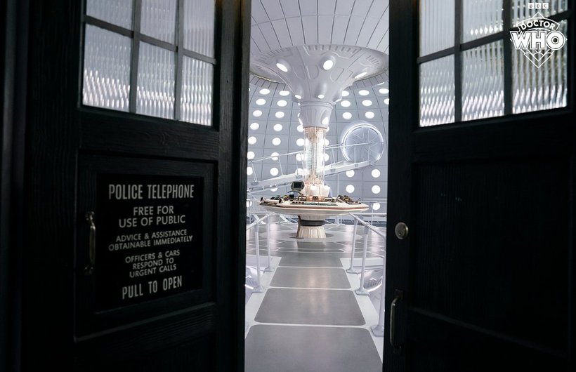 The TARDIS doors opening to reveal the sleek white accessible interior.