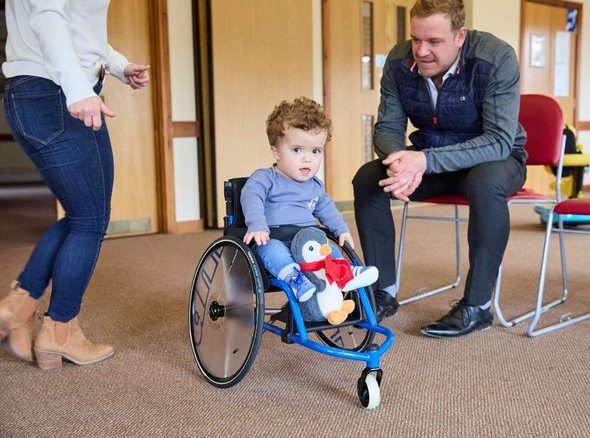Jake in his super cool blue light weight wheelchair at a Whizz Kidz clinic