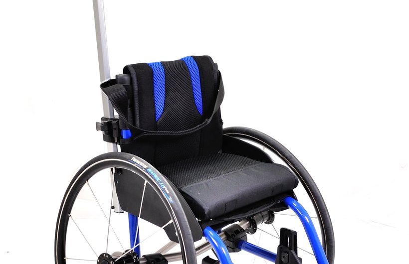 A blue and black Panthera Micro wheelchair for under 5s