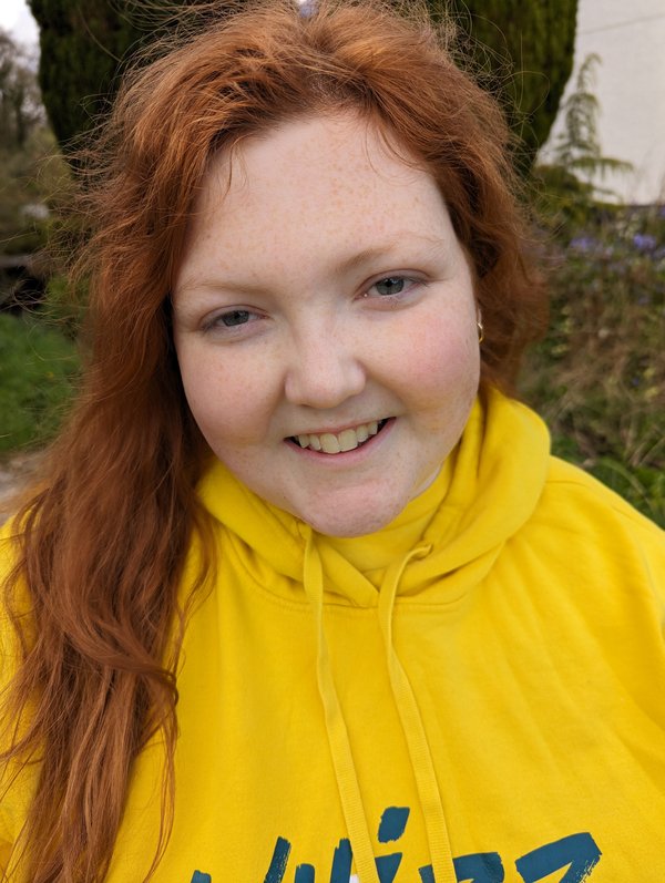headshot of Sophie wearing her Whizz Kidz hoodie
