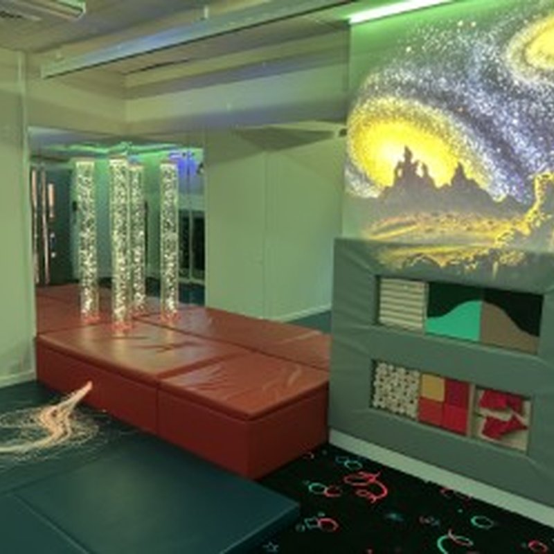 A sensory room with a lovely picture on the wall