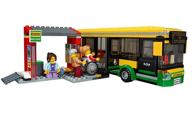 Wheelchair user accessing a Lego bus using a ramp