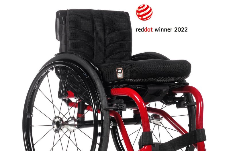 A black and red Nirtum manual wheelchair