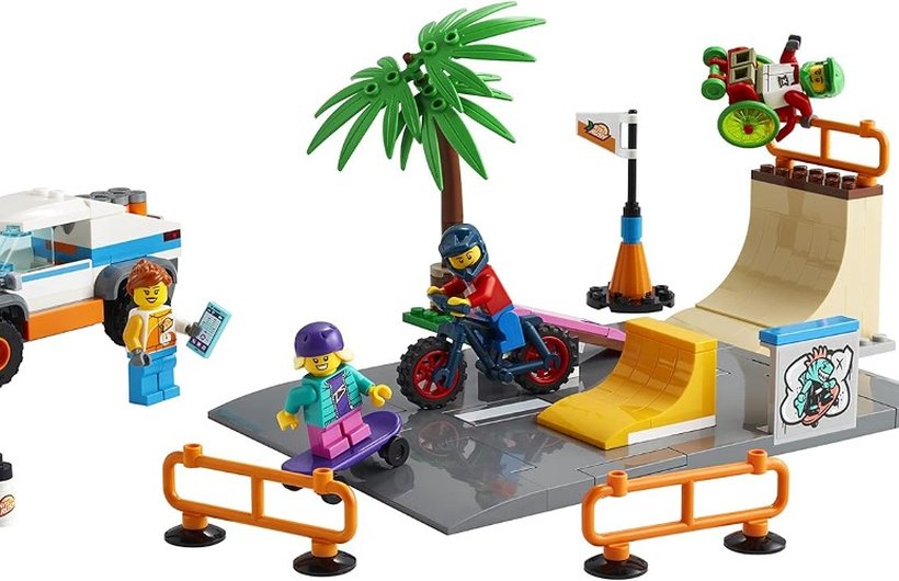 Lego skate park. The wheelchair user min-figure is flying in the air from the half pipe.