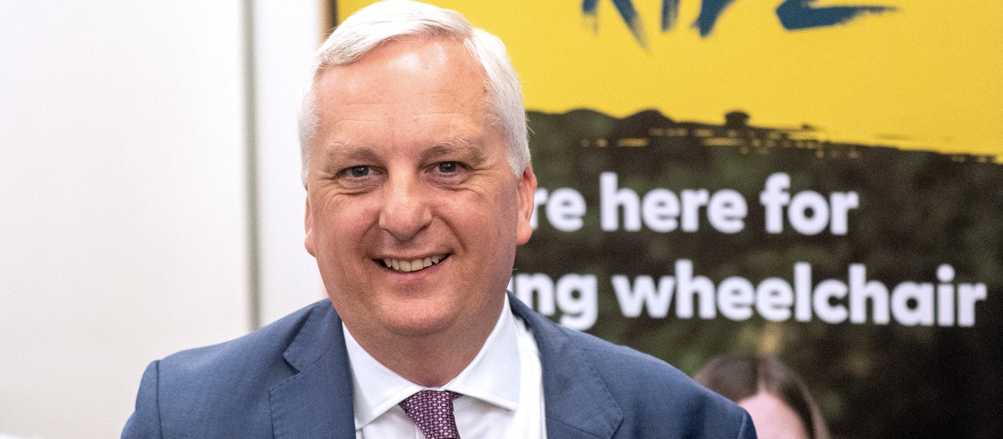 Image of Daniel Francis MP holding the Education report launched in Westminster