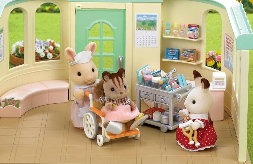Sylvanian Families scene in the country hospital with an animal in a wheelchair.