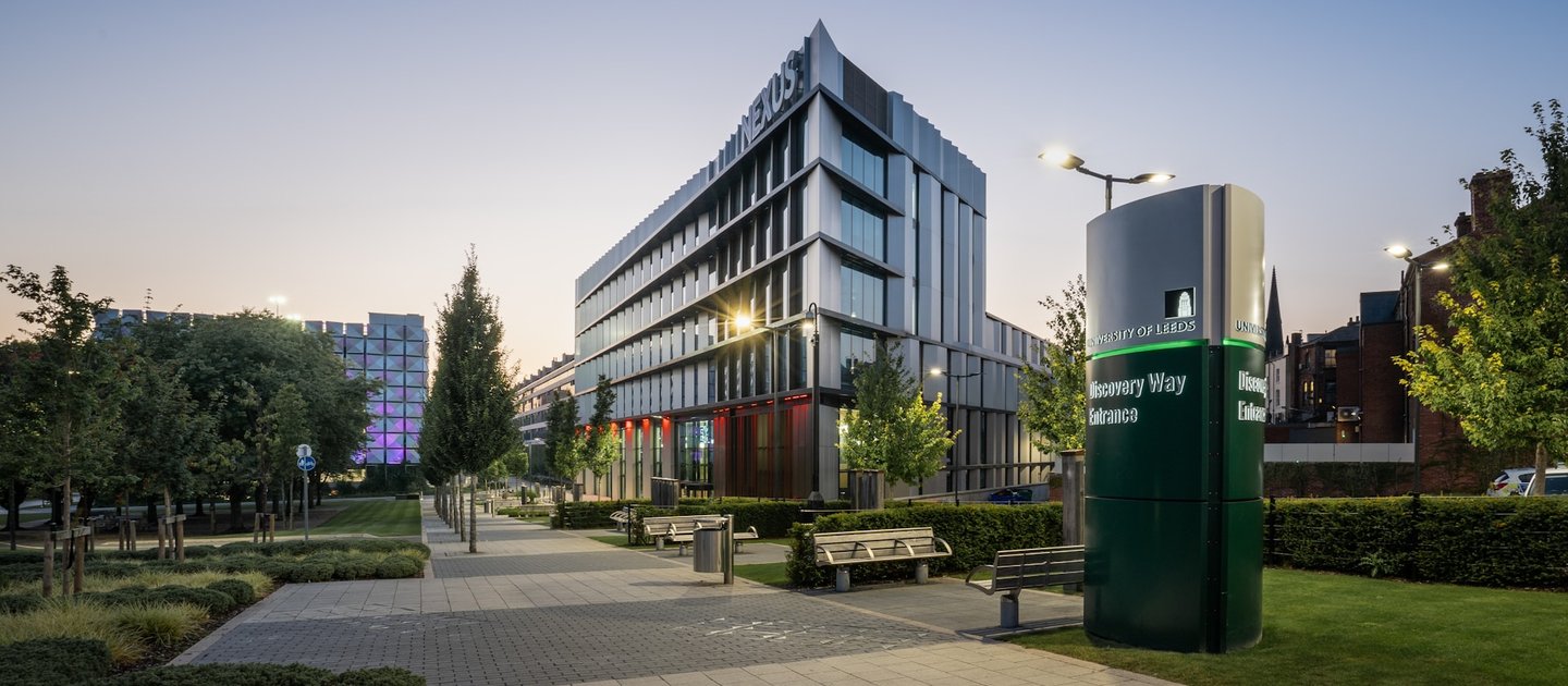 A modern looking university building set in early evening time