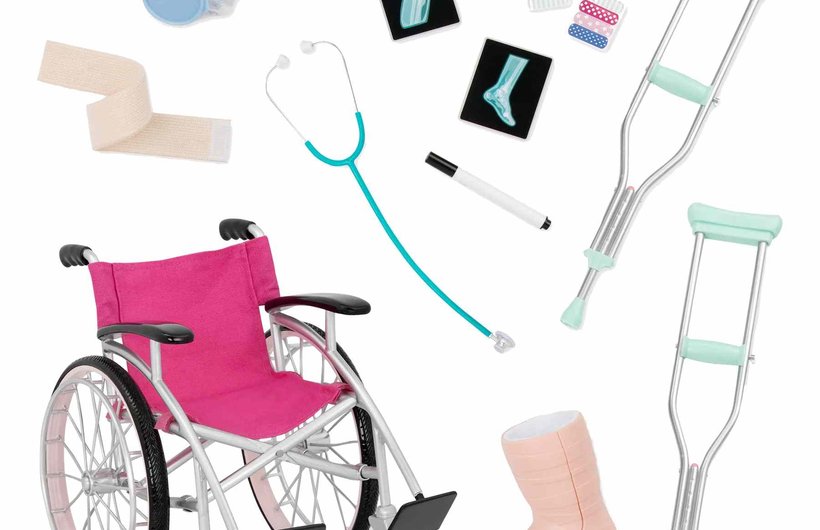 Wheelchair with pink seat and back and various medical accessories
