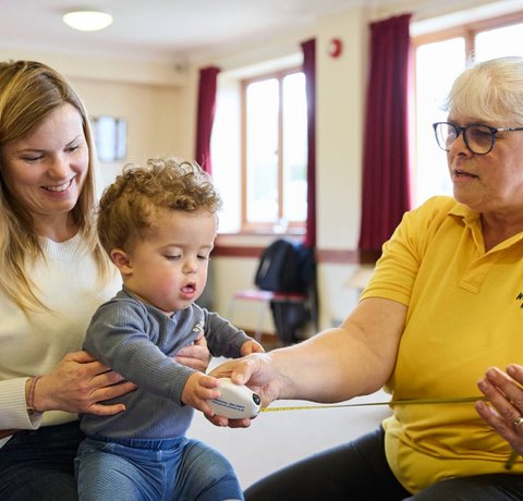 Jake gets measured for his new wheelchair by Whizz Kidz's Senior Mobility Therapist, Sarah Wallace