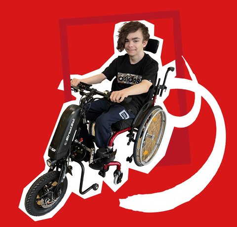 A young person in a a wheelchair with a power-assist add-on. They are 'cut-out' on a bright red background.