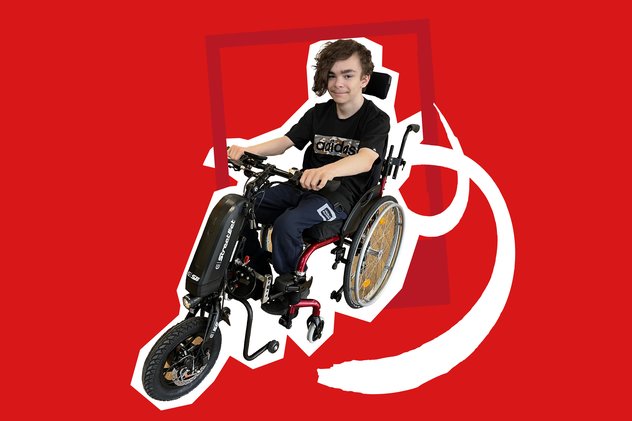 A young person in a a wheelchair with a power-assist add-on. They are 'cut-out' on a bright red background.
