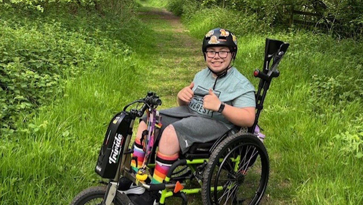 Ollie in the countryside giving a thumbs up