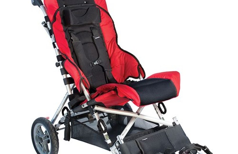 A red and black Convaid Cruiser special needs buggy