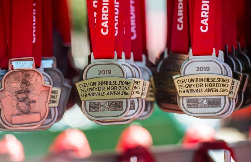 Medals from the Cardiff Marathon hang down on display
