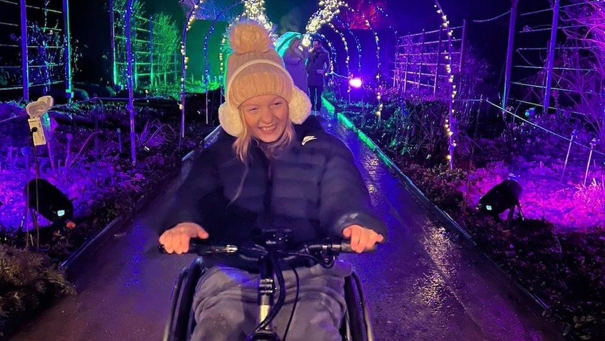 Sophia in wheelchair surrounded by lights